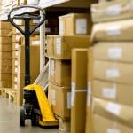 A manual pallet jack in a warehouse aisle.