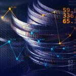 Stack of coins illustrated with stock exchange graphics.