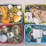 Four different container for sorting garbage for plastic, paper, metal and organic waste