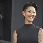 Chef Kristen Kish, wearing a black sleeveless mock turtleneck and mic headset speaks at a culinary demonstration during the 2025 Bottle Rock Napa Valley festival.