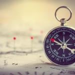 Magnetic compass on a world map.