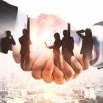 Illustration of businesspeople and a handshake.