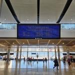 View of the Parallel Reality Experience, a personalized large screen monitor with flight information for Skymiles members at the Salt Lake City Airport.