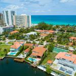 Aerial shot of luxury Miami homes with ocean in background.