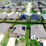 New construction home with solar panel roofs in rapid growing Princeton, Collin County, North Texas.