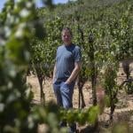 Jason Haas, owner of Tablas Creek Vineyard, stands amongst rows of grape vines at his vineyard in Paso Robles on July 30, 2025. 