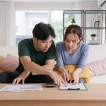 A young couple organizing expenses.