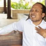 A middle-aged man suffering from acid reflux.