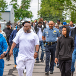  Roderick Parker, in white, Director of Big Hearts Community Projects at the 1,000 person march against gun violence in Fort Wayne, Indiana, on May 25th, 2025.