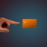 A hand levitating a credit card.
