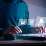 Businessman sending email to customer.