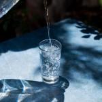 Water being poured onto a glass.