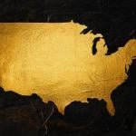 A map of the United States rendered in gold foil.