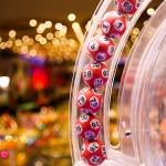 Red lottery balls in a bingo machine in a casino.