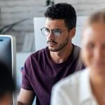 Focus shot on a young male entrepreneur working in an office.