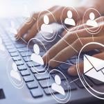 Hands typing on a keyboard illustrated with email and figure icons.