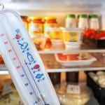 A temperature in front of an open refrigerator.