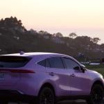 Pink toyota venza that looks lavender parked at mount soledad in san diego during sunset golden hour.