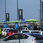 Uber vehicles lined up at the new 'LAX-it' ride-hail passenger pickup lot at Los Angeles International Airport (LAX), California.