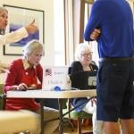 A voter receives a thumbs up from a poll worker after a successful check in at Biltmore Forest Town Hall during the 2024 U.S. election in Asheville, North Carolina. 