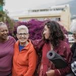 A group of four multigenerational women after a yoga class.