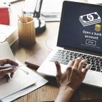 A businesswoman navigates a page to open a bank account.