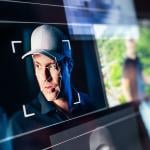 Picture of man's face on a computer screen.