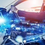 A driver inside a car illustrated with intelligent technology graphics.