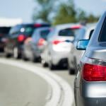 One side of the road with bumper-to-bumper traffic.