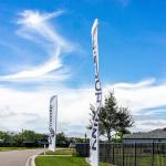 Sign banner flags outside a residential home community built by developer company, Pulte PulteGroup, in Florida.