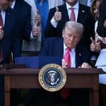 US President Donald Trump signs the 'Big Beautiful Bill Act' at the White House in Washington, DC on July 4, 2025. 