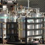  Industrial Oxygen cylinders waiting in racks outside filled and waiting to be put into use in Watsonville , California.