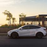 A white Tesla Model Y on the road.
