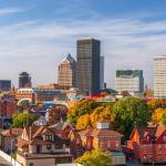 Rochester, New York, USA downtown city skyline colorful in early autumn season.