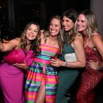Marisa Peters (2nd L) poses for a selfie with guests at the BE SEEN Gala on June 7, 2025 at Harriet's Rooftop in Los Angeles, California.
