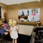 A 3D illustration of two groups communicating via virtual reality.