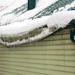 Heavy snow destroys as it accumulated on a home's drainage system.