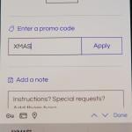 A Christmas promo code added into a shopping app checkout page.