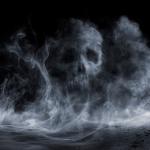 Fog forming a figure of a skull on dark background.