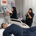 Students practice with a mannequin simulating a patient at the Mt. San Antonio College campus in California.
