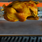 A turkey being on a rotisserie grill.