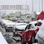 State police supervise the cleanup of a 54-car pileup in the snow on the Kennedy Expressway near downtown on April 15, 2020 in Chicago, Illinois.
