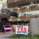 A sign urging voters to vote yes on judicial retention outside a polling place in Harrisburg, Pennsylvania, on Election Day.