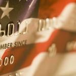 A close up of a credit card designed with the US flag.