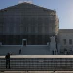 U.S. Supreme Court Police direct visitors from behind security barriers in front of court building, which is obscured in construction scaffolding, on the first day of the Court’s new term on October 06, 2025 in Washington, DC.  
