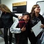 A wife and her children crying as her husband is detained by federal agents outside a New York Federal Plaza Immigration Court room in New York City.