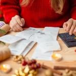 Person calculating expenses for the holidays.