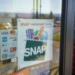 A 'SNAP welcomed here' sign at the entrance of a Big Lots store in Portland, Oregon.