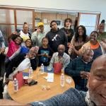  Dexter Hall, right, takes a self-portrait with formerly unhoused elders working with youth navigating homelessness.