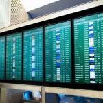 A flight arrival and departure board at an airport.